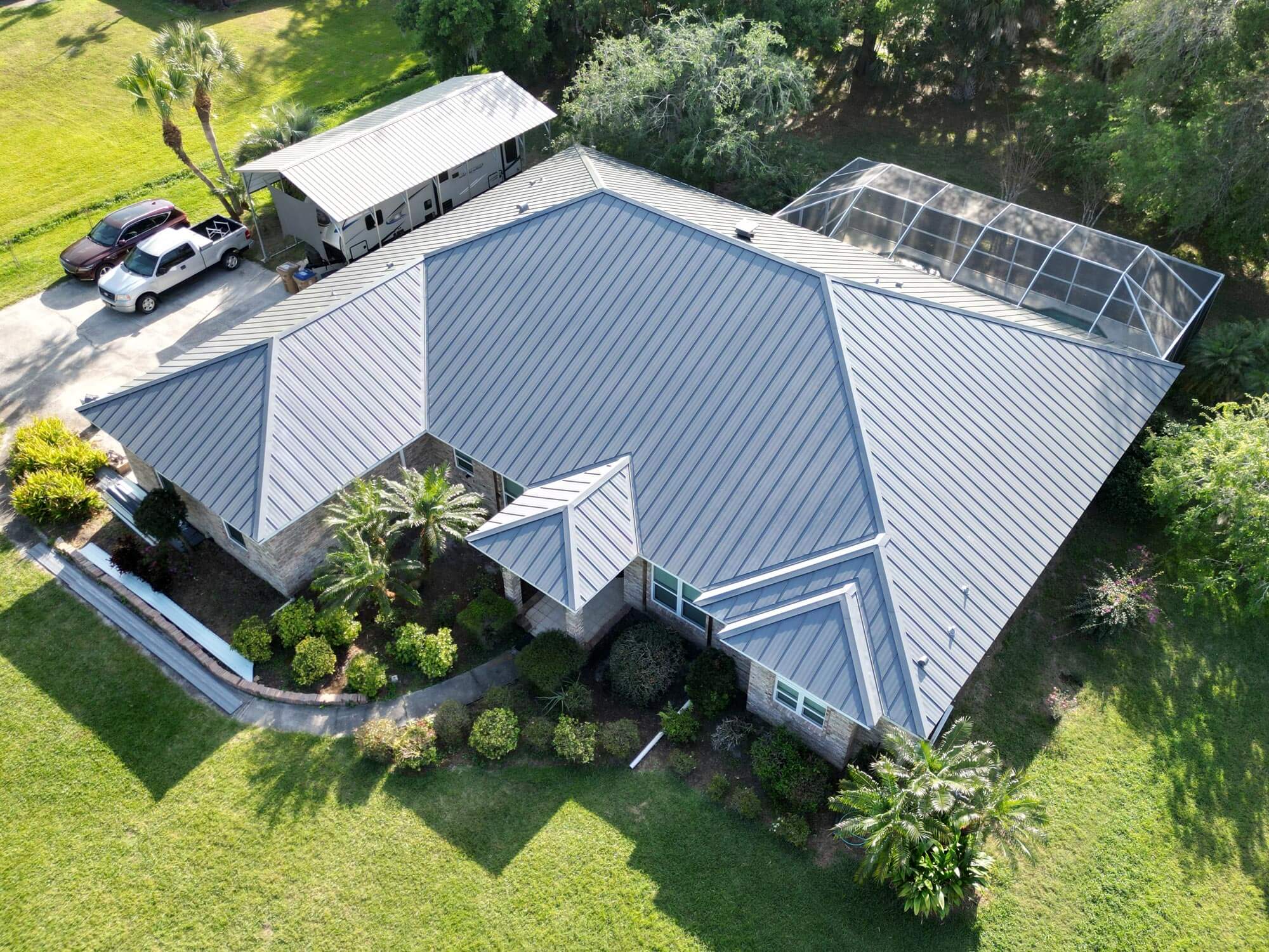 Image shows Central Florida home with a standing seam metal roof newly installed.
